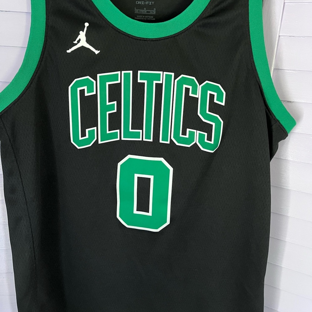 Celtics Black and Green Basketball Jersey features #0 TATUM.  Older boys size L